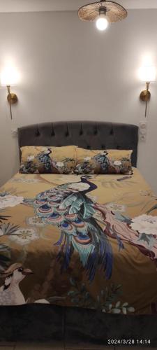 a bed with a painting of a horse on it at Studio Paris in Paris