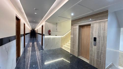 a corridor of a building with a hallway at Raksha Suites & Banquet Greater Noida in Greater Noida