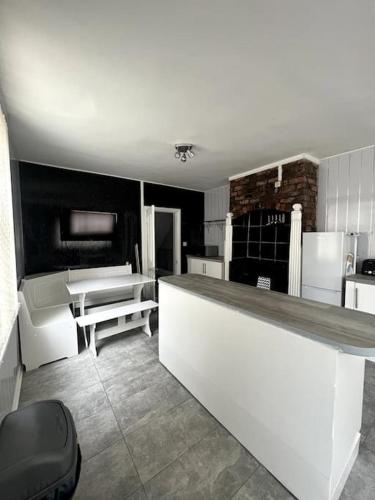 a kitchen with a white counter in a room at No. 206 - Spacious 5 Bed in Liverpool