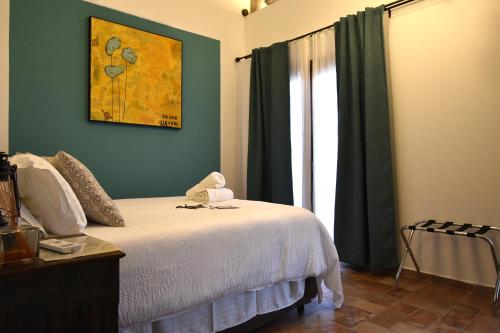 a bedroom with a bed and a window at Cascina Tre Botti in Agliano Terme