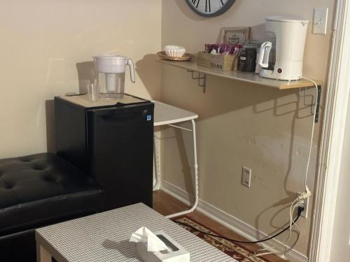 a kitchen with a blender on top of a refrigerator at Sweet 1 bed room, for female only in Ottawa