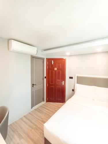 Postel nebo postele na pokoji v ubytování Starry Beach Inn