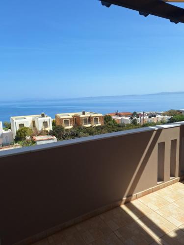 a balcony with a view of the ocean at Evangelia in Karfas