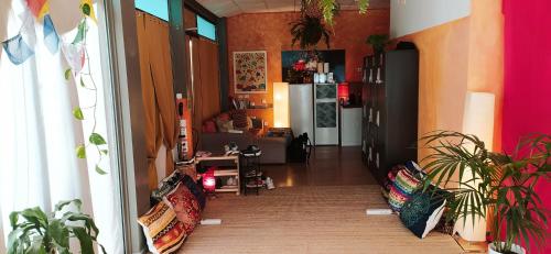 a hallway with a kitchen and a living room at Nirvana Yoga Center in Arrecife