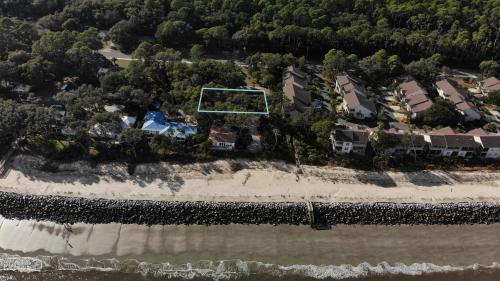 an aerial view of a beach with houses and condos at OCEAN RETREAT home in Jekyll Island