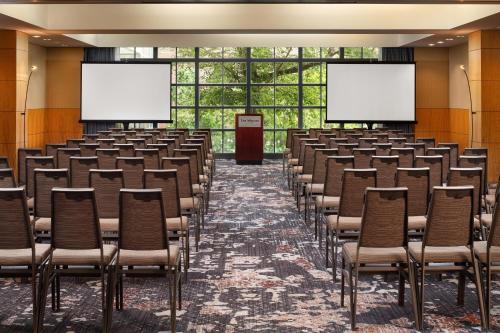 an empty lecture hall with chairs and screens at The Westin St. Louis in Saint Louis