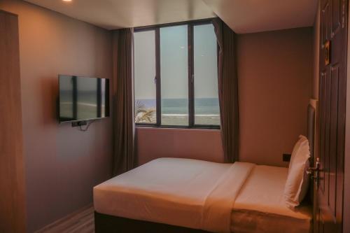 TV a/nebo společenská místnost v ubytování Starry Beach Inn
