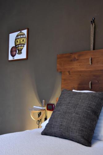 a bedroom with a bed with a basketball picture on the wall at Cascina Tre Botti in Agliano Terme