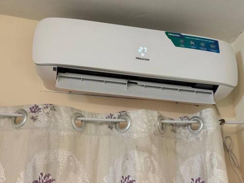 a printer sitting on top of a curtain at Grandiose apart in yaounde in Yaoundé