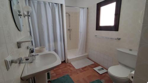 a bathroom with a toilet and a sink and a shower at Casa Alberto - Altea in Altea