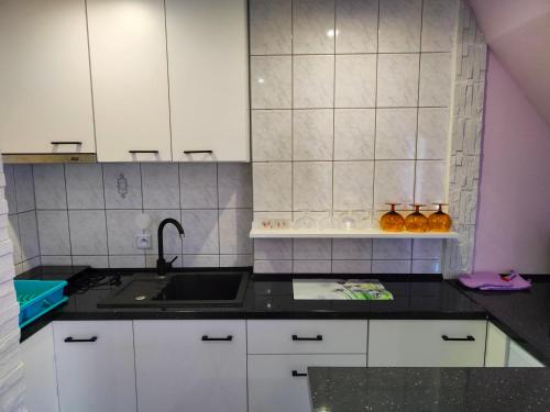 Η κουζίνα ή μικρή κουζίνα στο Bajeczny Wypoczynek Apartamenty