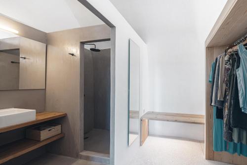 a bathroom with a mirror and a sink at Casa Kombonada in Kýthira