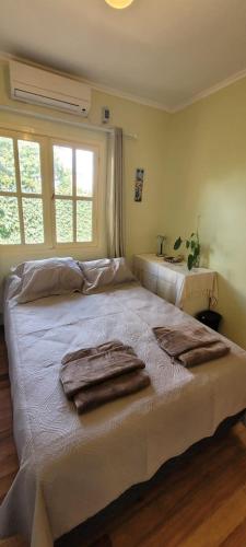 Ένα ή περισσότερα κρεβάτια σε δωμάτιο στο Ombú Guests House