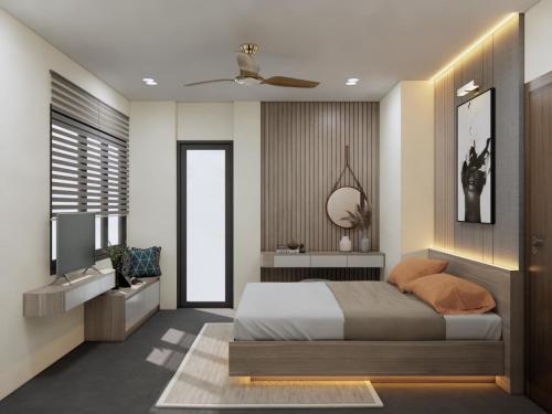 - une chambre avec un lit king-size et une télévision dans l'établissement DRAGON HUE HOTEL, à Hue