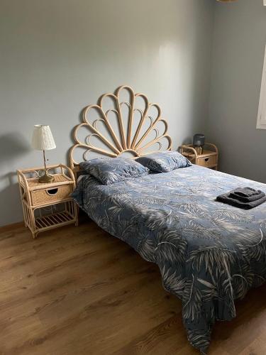a bedroom with a bed and two night stands at Villa Ty Loin vue mer 5 personnes in Logonna-Daoulas