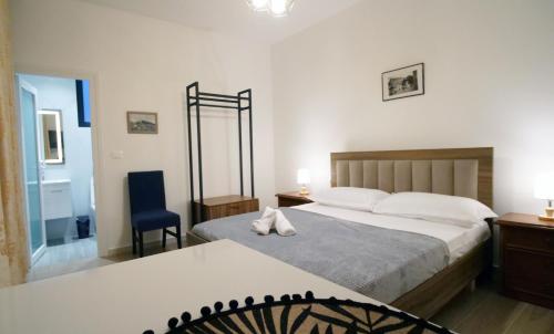 Postel nebo postele na pokoji v ubytování Villa Balliu