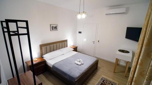 Postel nebo postele na pokoji v ubytování Villa Balliu