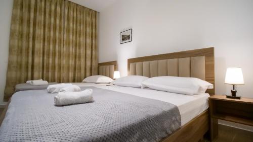 Postel nebo postele na pokoji v ubytování Villa Balliu
