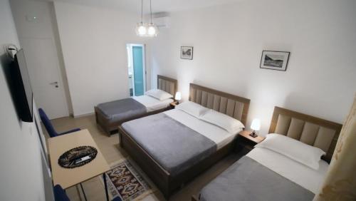 Postel nebo postele na pokoji v ubytování Villa Balliu