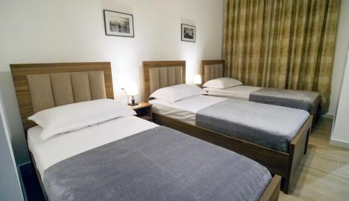 Postel nebo postele na pokoji v ubytování Villa Balliu