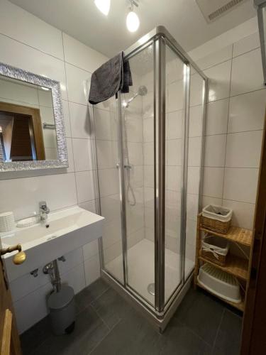 a bathroom with a shower and a sink at Apart Sonnenheim in Kaunertal