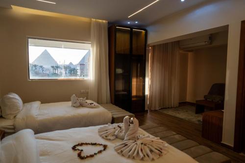 Lova arba lovos apgyvendinimo įstaigoje Tuya Pyramids Inn hotel