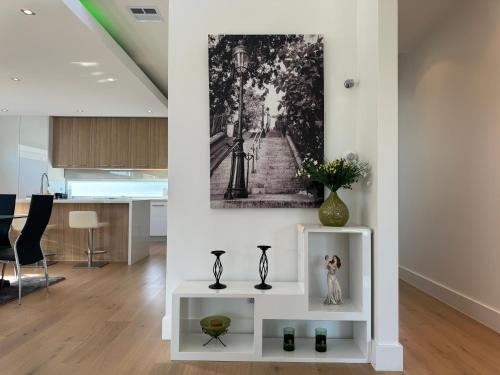 a living room with a painting on the wall at Geelong Beach Q House in North Shore