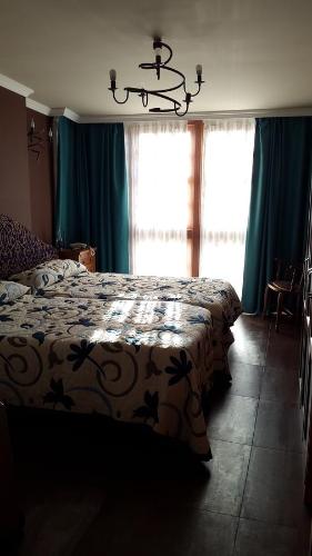 Ένα ή περισσότερα κρεβάτια σε δωμάτιο στο Hostal Medievo