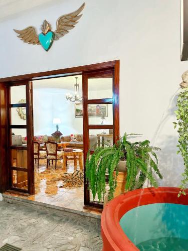 a living room with a bird on the wall at Casa Balam Bed & Breakfast Boutique in Ciudad Vieja