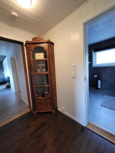 a room with an old wooden cabinet in a room at Sweet Cabin Leknes in Leknes