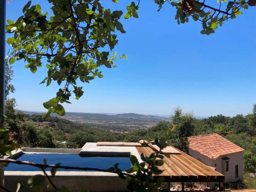 a villa with a swimming pool with a view at Vigias -Eternal Landscapes in Marvão