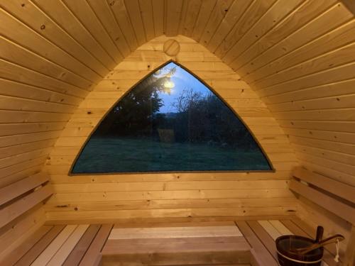 an inside view of a sauna with a window at Villa vue saksild strand in Odder