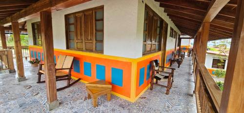 a model of a house with chairs on a porch at PUENTE IGLESIA in Montenegro