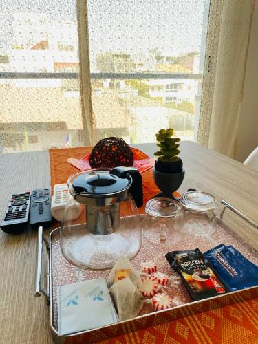 a table with a tray of food on a table at SuAparts in Praia