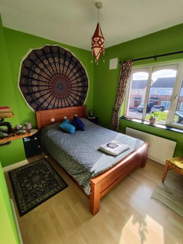 a bedroom with a large bed in a green room at The Green Room Homestay in Galway