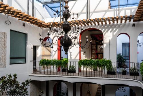 a building with a chandelier hanging from the ceiling at HOTEL BOUTIQUE CASONA 65 in Puebla