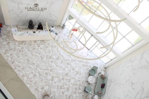 an overhead view of a bathroom with a white tile floor at Gadileh Resort Hotel in Djibouti