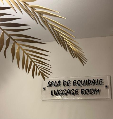 a sign hanging from the ceiling of a room at Hostal LA POETISA - Auto Check-in in Culleredo