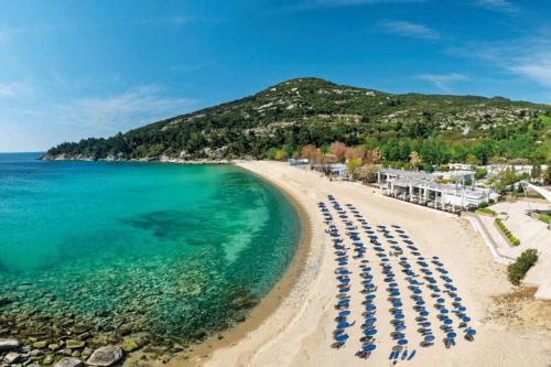 an aerial view of a beach with chairs and the ocean at Philoxenia in Kavala
