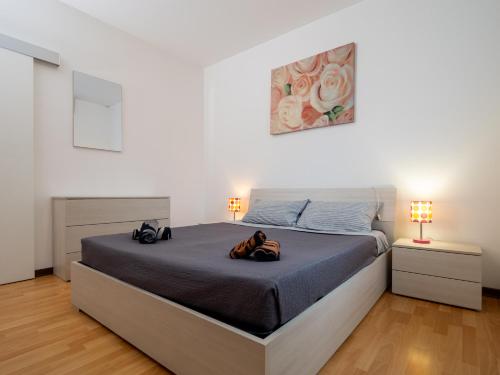 Un pat sau paturi într-o cameră la Appartamento in Centro a Udine