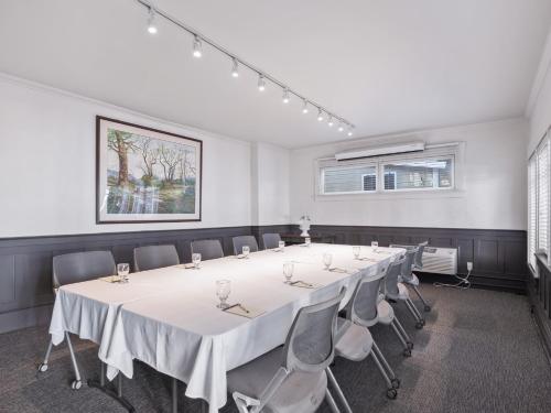 a conference room with a long table and chairs at The Upham Hotel in Santa Barbara