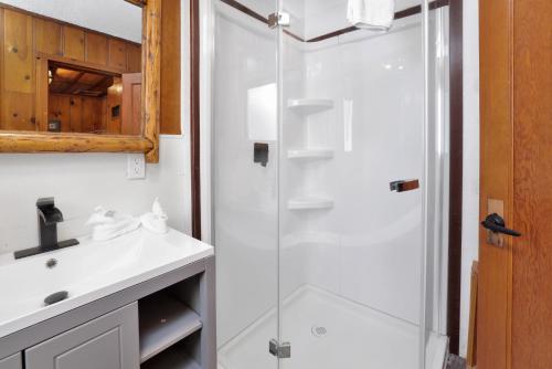a bathroom with a shower and a sink at Little Pines Couples Lakeside Cabin by Big Bear Vacations in Big Bear Lake