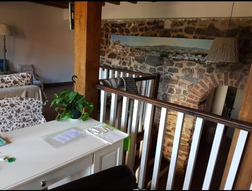 a room with a staircase with a brick wall at Casa restaurada en pequeño pueblo de montaña in Pujayo
