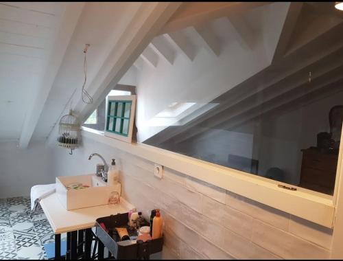 a bathroom with a sink and a mirror on the wall at Casa restaurada en pequeño pueblo de montaña in Pujayo