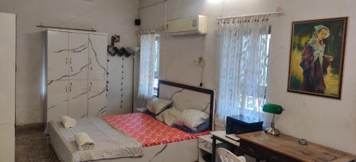a small room with a small bed in it at Nest in Nashik