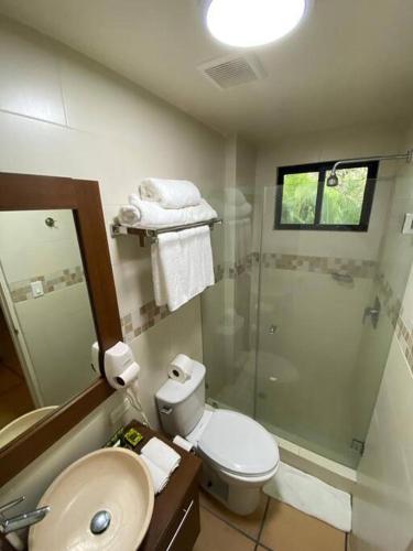 a bathroom with a shower and a toilet and a sink at Coronado Tower Suite Escapada de Lujo en Coronado Luxury Club in Playa Coronado