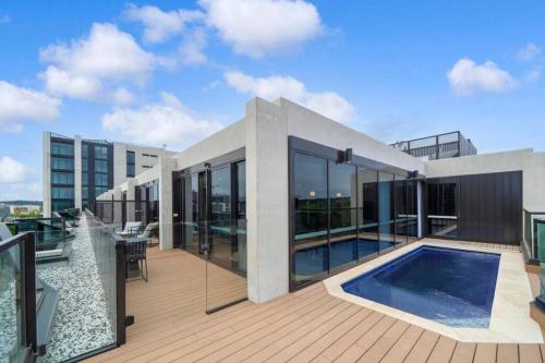 a house with a swimming pool on a balcony at Canberra City - Parking - Self check-in - Pool in Canberra