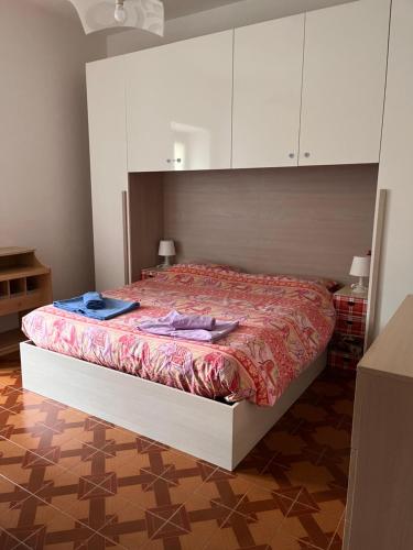 a bedroom with a bed with white cabinets at Il Cortile Como Single & Double Room da Manu Hope&Toffee in Como