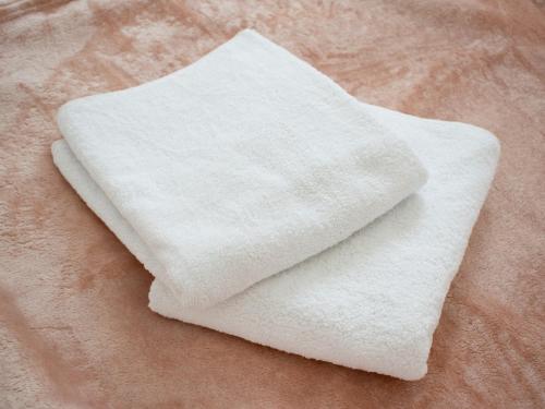 a white towel sitting on top of a table at An apartment M & K - 70 m2 in Ljubuški