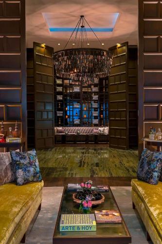 a living room with a couch and a table at The St. Regis Mexico City in Mexico City